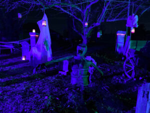 Halloween 2020 - DIY Paper Mache Corpse under purple light in a Halloween Cemetery