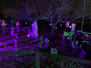 Halloween 2020 - Halloween Cemetery with Coffin Cart, Tombstones, Corpse, Candles and green and purple lighting