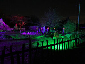 Halloween 2020 - Halloween Cemetery with tombstones under green and purple lights