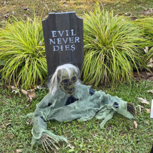 Medium Round Dog Ear tombstone painted with "Evil Never Dies"