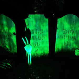 Medium Wood Tombstones with Hocus Pocus customization in green light at night