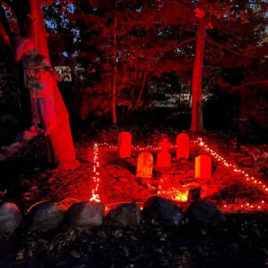 Tombstone Trio and Medium wood tombstones in a red light Halloween cemetery