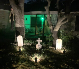 Tombstone Trio with a green light in the background