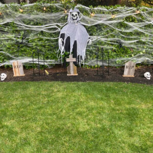 Tombstone Trio with grim reaper and Halloween cemetery decorations