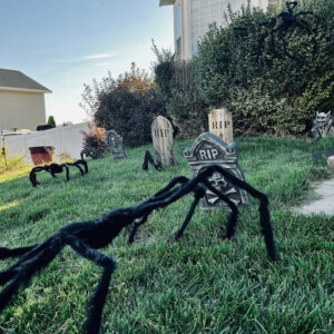 Wood tombstones mixed in with Halloween decor