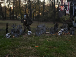 Wood Tombstones with Grave Digger in a Halloween Cemetery